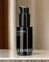 SU HAIROIL – Bio Haaröl ohne Silikone in hochwertiger Glasflasche, ideal für die tägliche Haarpflege.